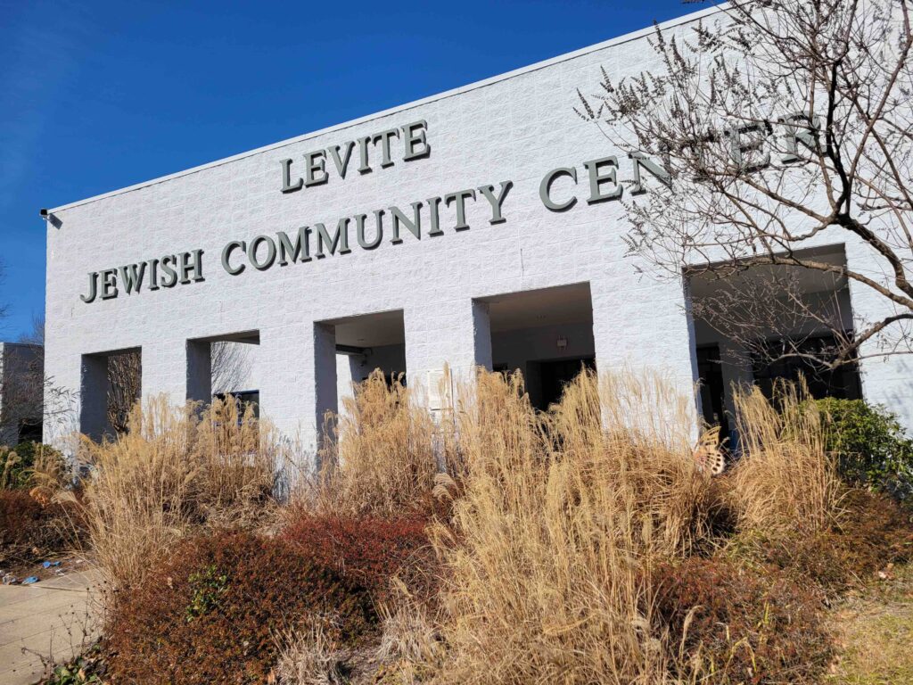 A photo of the white Levite Jewish Community Center with blue sky in the background