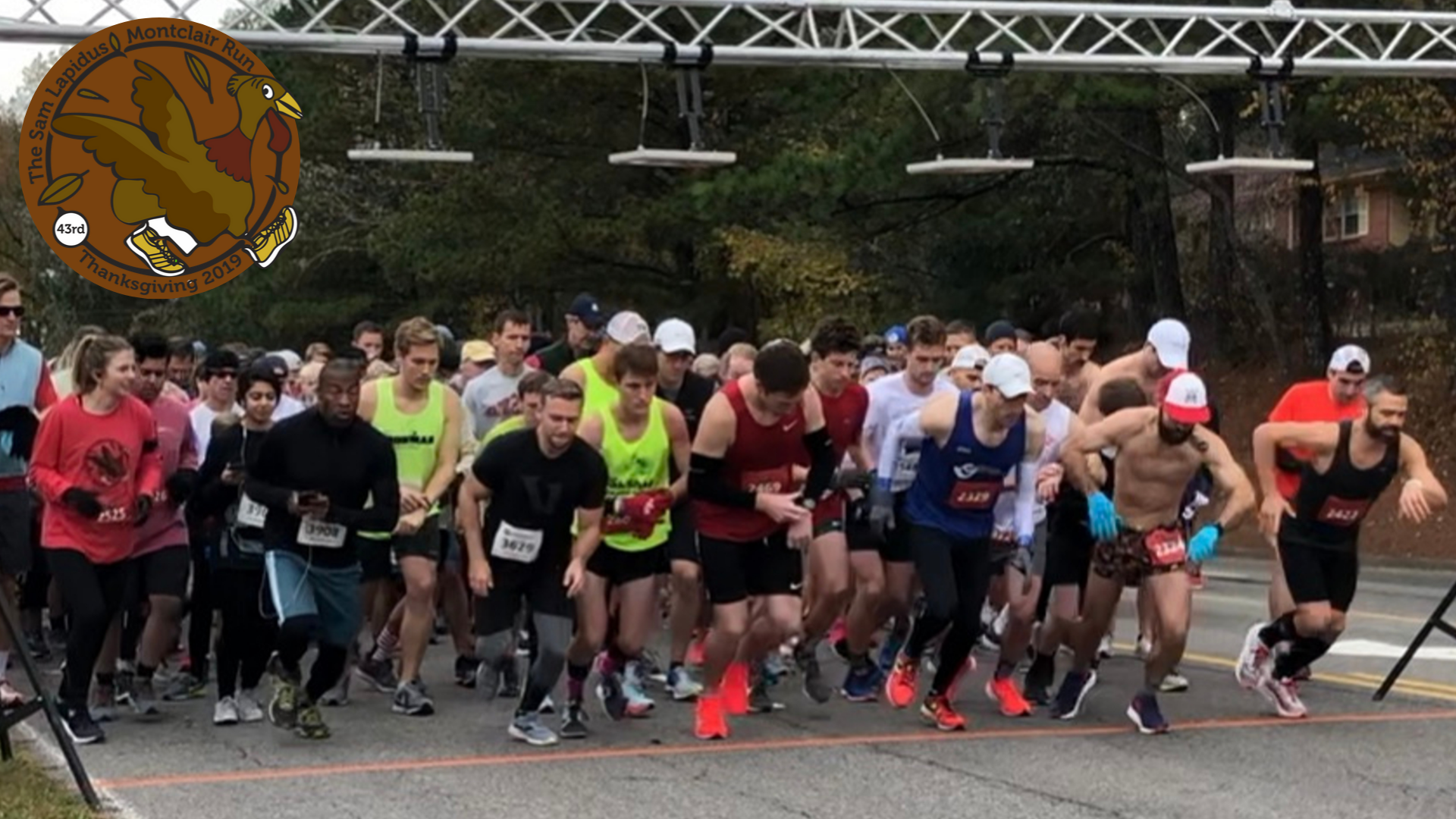 A group of runners starting a race on a road