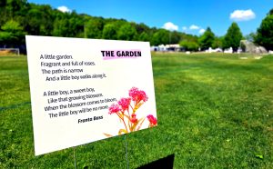 A yard sign displays a Holocaust-era poem on Levite Field at the Levite JCC