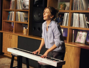 Morgan Smith playing the keyboard during Every Brilliant Thing performance.
